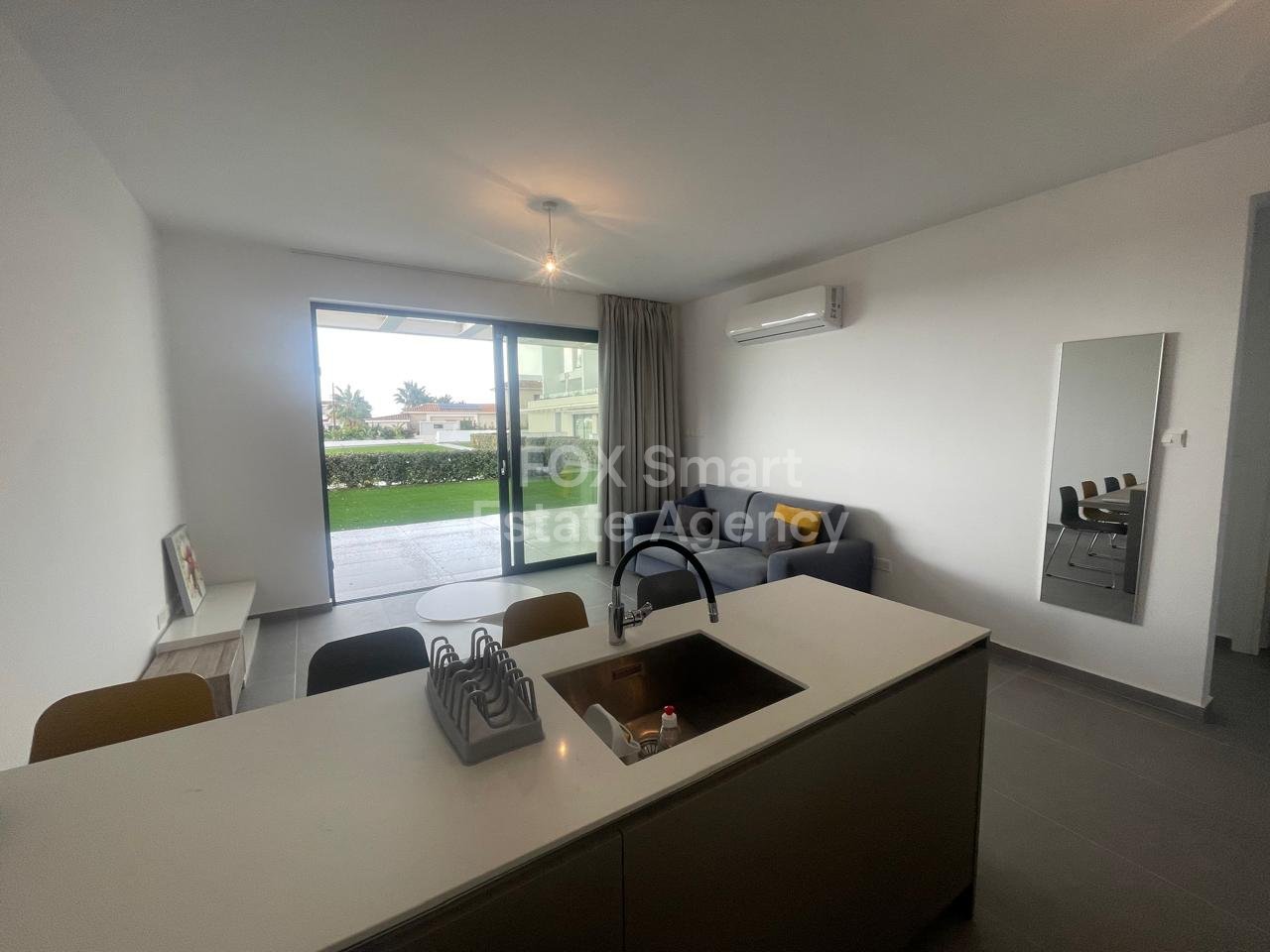 Garden Haven – Absolute Beachfront Living | Perivolia