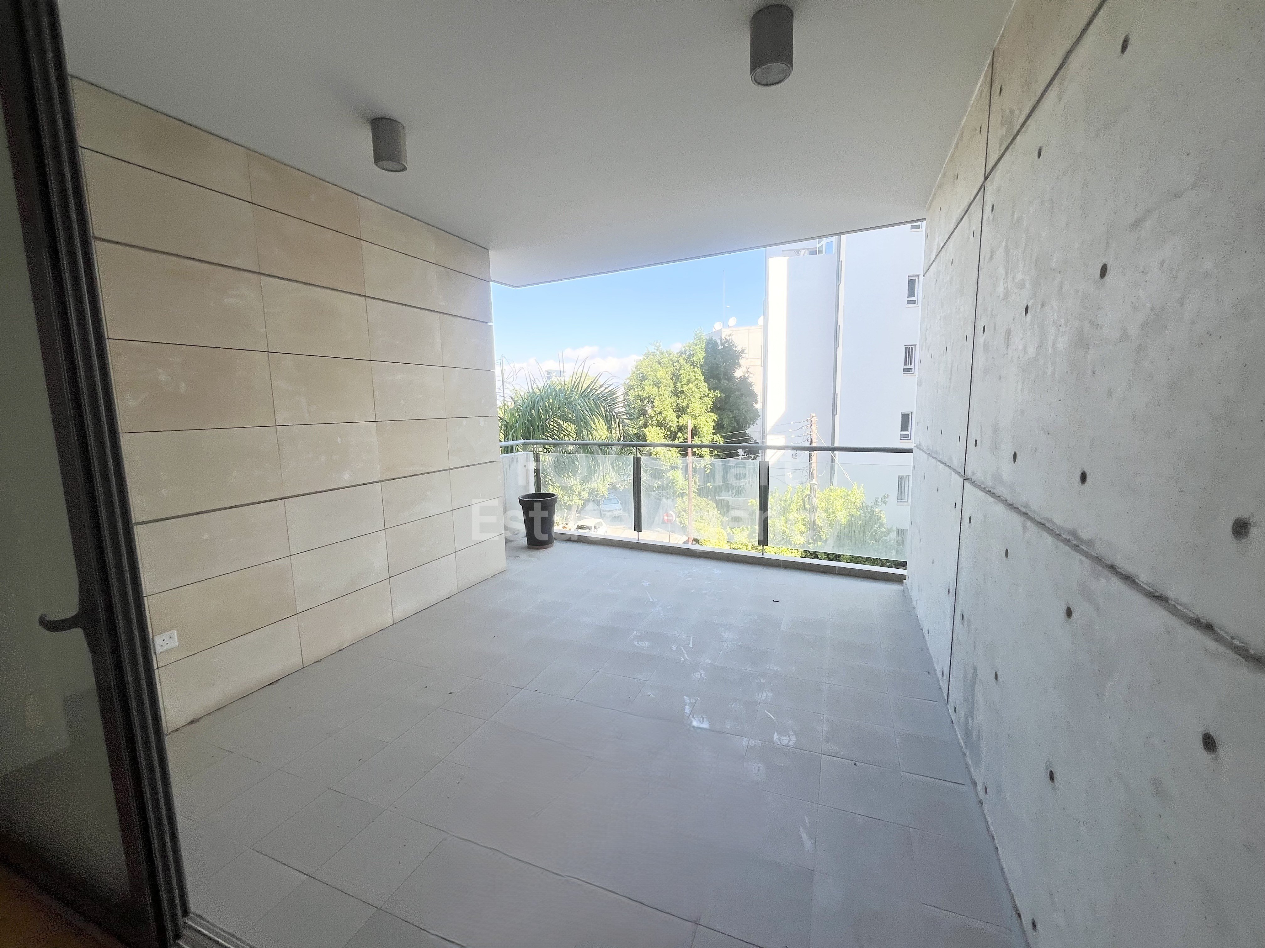 For rent 2 bedroom unfurnished  apartment close to KPMG and John Kennedy Street in Acropolis, Nicosia.